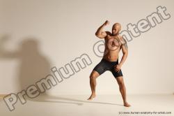 Underwear Gymnastic poses Man Black Muscular Bald Dancing Dynamic poses Academic